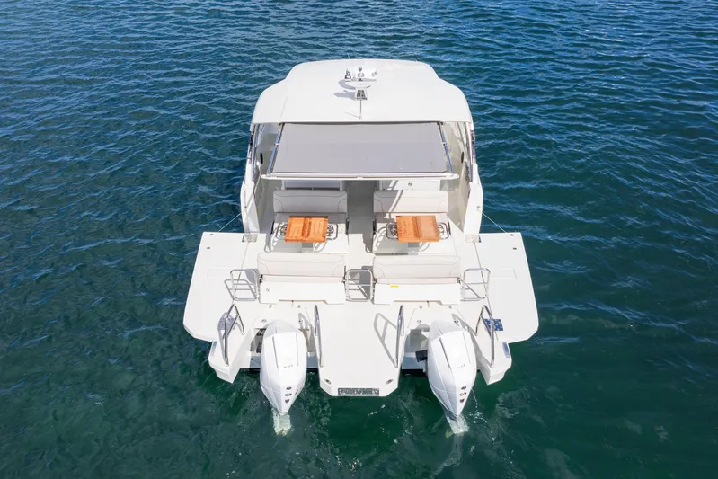 Yacht Photos Pics 2025 Catana YOT 36 catamaran on water, rear view with twin engines.