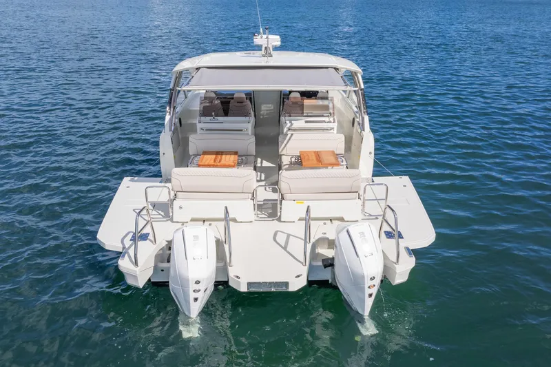  Yacht Photos Pics 2025 Catana YOT 36 boat on water, rear view with twin engines and seating area.