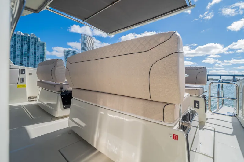  Yacht Photos Pics Luxurious seating on 2025 Catana YOT 36 yacht with city skyline backdrop.