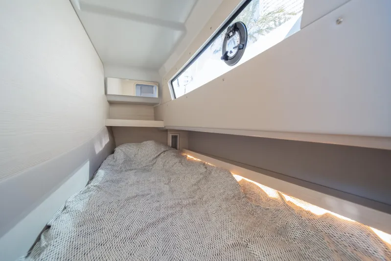  Yacht Photos Pics Interior cabin of 2025 Catana YOT 36, featuring a cozy bed and window.