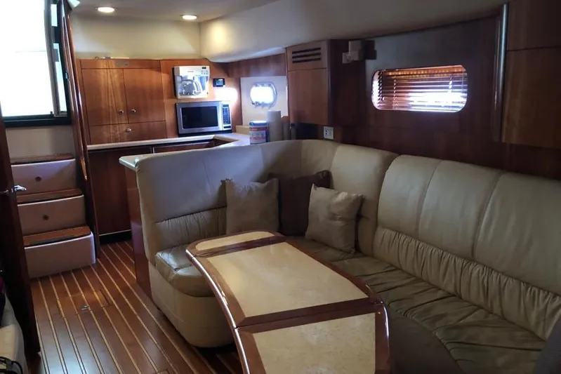 Eye Catcher Yacht Photos Pics Luxurious interior of 2004 Tiara Yachts 4400 Sovran with leather seating and modern amenities.