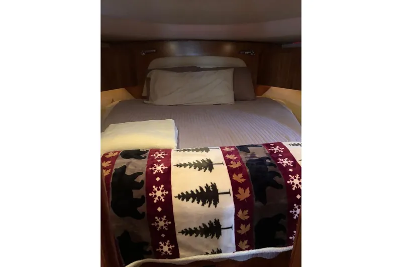 Eye Catcher Yacht Photos Pics Cozy cabin bed in 2004 Tiara Yachts 4400 Sovran with decorative blanket.