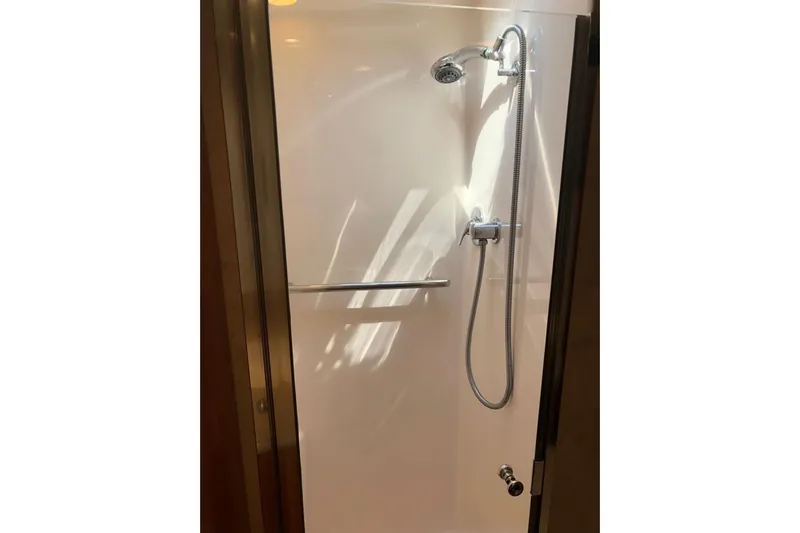 Eye Catcher Yacht Photos Pics Shower area in 2004 Tiara Yachts 4400 Sovran, featuring modern fixtures and sleek design.