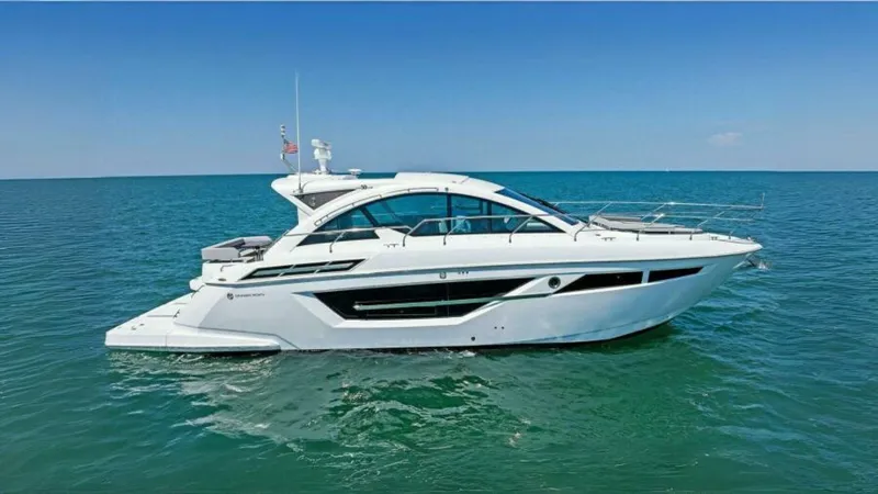Mint 2 Bee Yacht Photos Pics 2022 Cruisers Yachts 50 Cantius on open water, sleek design, sunny day.