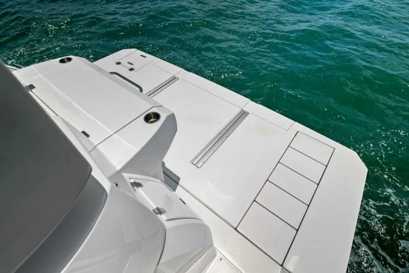 Mint 2 Bee Yacht Photos Pics 2022 Cruisers Yachts 50 Cantius swim platform on clear blue water.