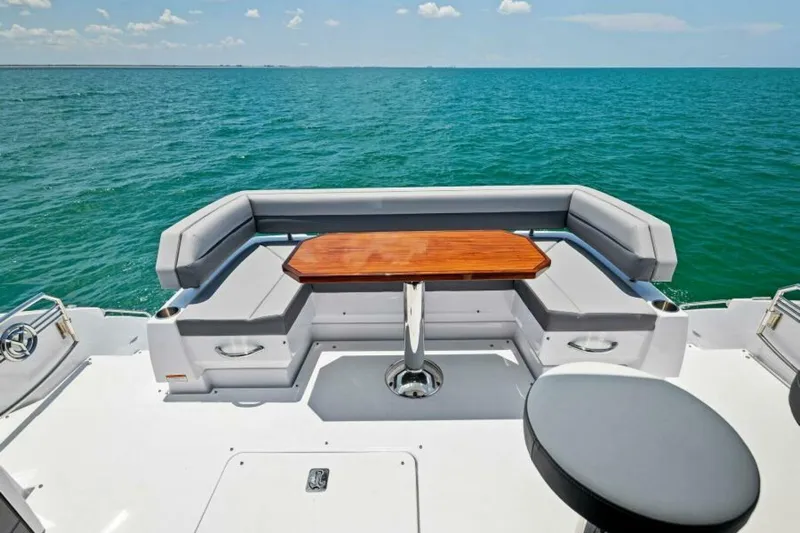 Mint 2 Bee Yacht Photos Pics 2022 Cruisers Yachts 50 Cantius deck with seating and ocean view.