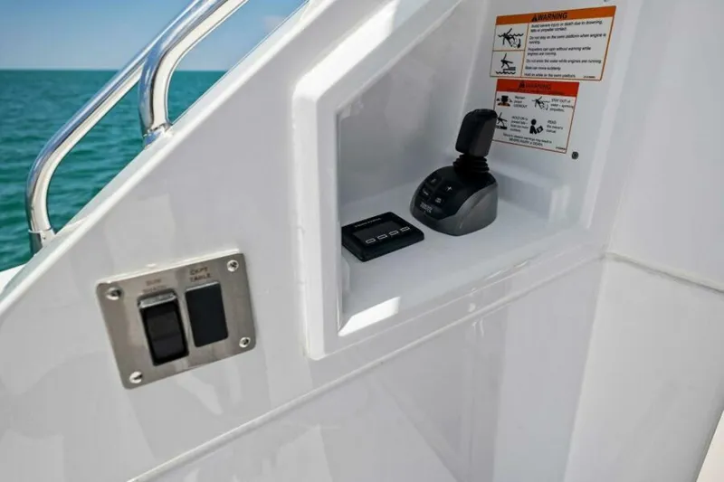 Mint 2 Bee Yacht Photos Pics Control panel on 2022 Cruisers Yachts 50 Cantius, featuring joystick and switches.