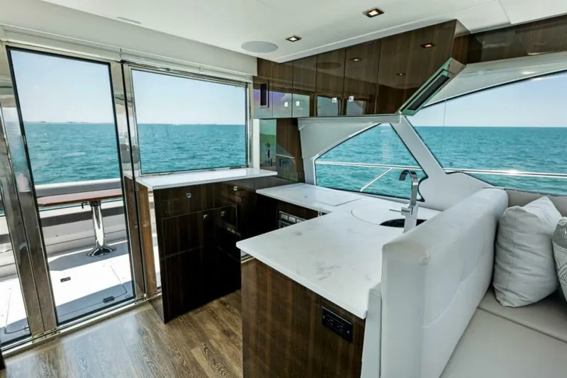 Mint 2 Bee Yacht Photos Pics Luxurious interior of 2022 Cruisers Yachts 50 Cantius with ocean view.