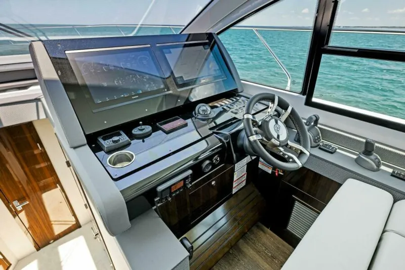 Mint 2 Bee Yacht Photos Pics 2022 Cruisers Yachts 50 Cantius helm with modern controls and ocean view.