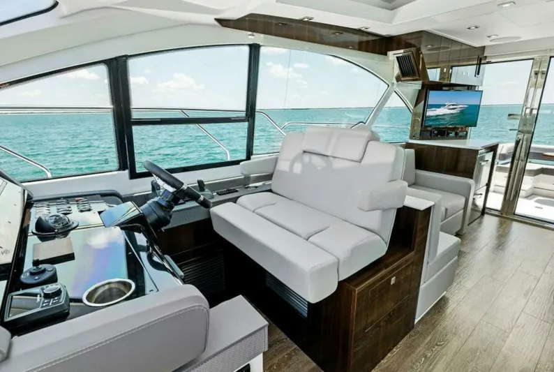Mint 2 Bee Yacht Photos Pics Luxurious interior of 2022 Cruisers Yachts 50 Cantius with ocean view.