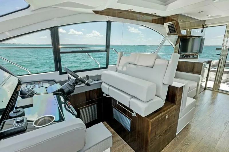 Mint 2 Bee Yacht Photos Pics Interior of 2022 Cruisers Yachts 50 Cantius with modern helm and ocean view.