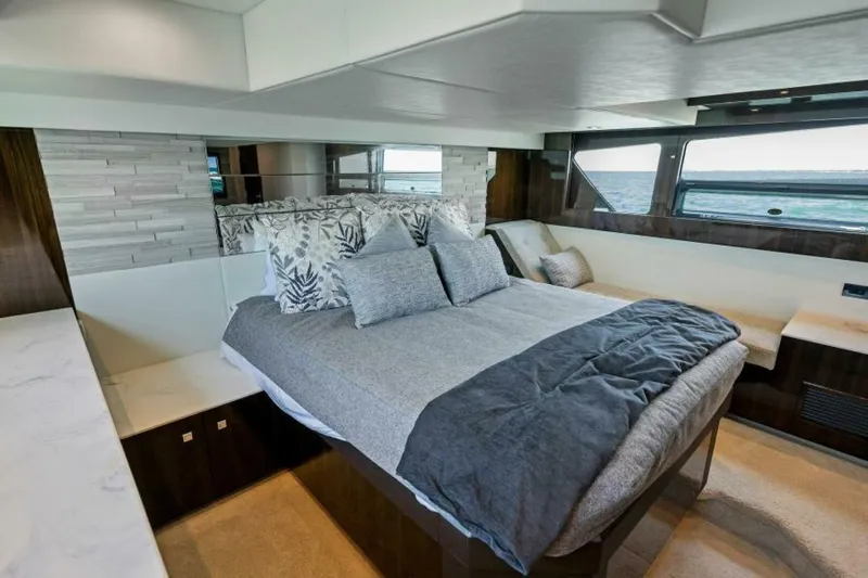 Mint 2 Bee Yacht Photos Pics Luxurious bedroom interior of 2022 Cruisers Yachts 50 Cantius with ocean view.