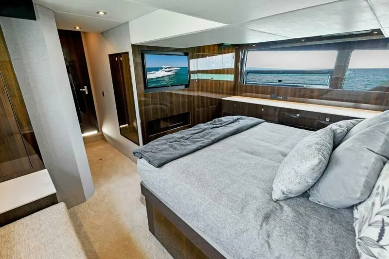 Mint 2 Bee Yacht Photos Pics Luxurious bedroom interior of 2022 Cruisers Yachts 50 Cantius with ocean view.