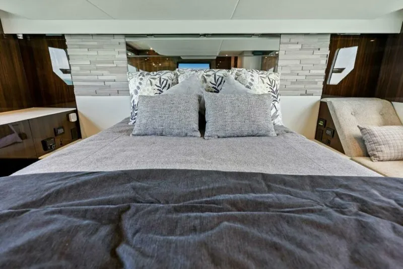 Mint 2 Bee Yacht Photos Pics Luxurious bedroom interior of 2022 Cruisers Yachts 50 Cantius with elegant bedding and decor.