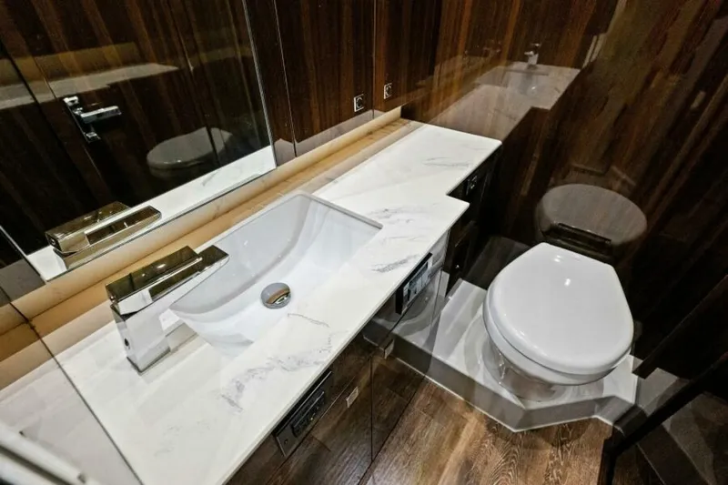 Mint 2 Bee Yacht Photos Pics Luxurious bathroom in 2022 Cruisers Yachts 50 Cantius with modern sink and toilet.