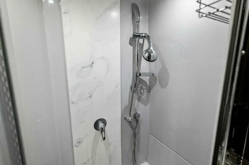 Mint 2 Bee Yacht Photos Pics Modern shower in 2022 Cruisers Yachts 50 Cantius, featuring sleek chrome fixtures.