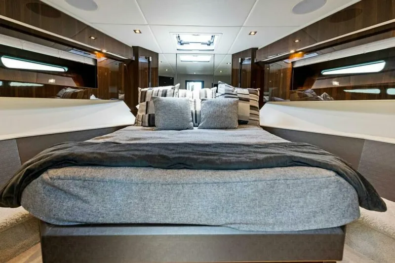 Mint 2 Bee Yacht Photos Pics Luxurious bedroom interior of 2022 Cruisers Yachts 50 Cantius with modern design and plush bedding.