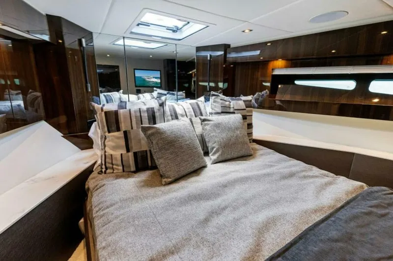 Mint 2 Bee Yacht Photos Pics Luxurious bedroom interior of 2022 Cruisers Yachts 50 Cantius with modern decor and skylight.