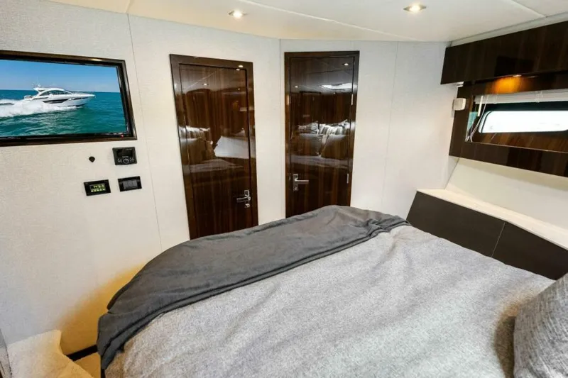 Mint 2 Bee Yacht Photos Pics Luxurious bedroom interior of 2022 Cruisers Yachts 50 Cantius with modern amenities.