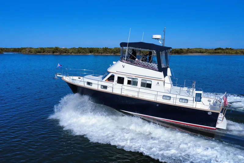  Yacht Photos Pics 2006 Albin 40 North Sea Cutter cruising on a sunny day, creating waves.