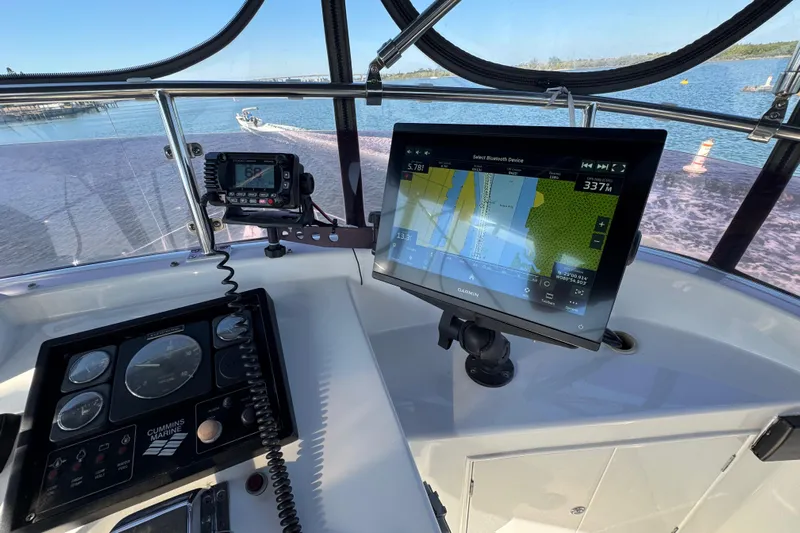  Yacht Photos Pics Helm of 2006 Albin 40 North Sea Cutter with navigation equipment and scenic water view.