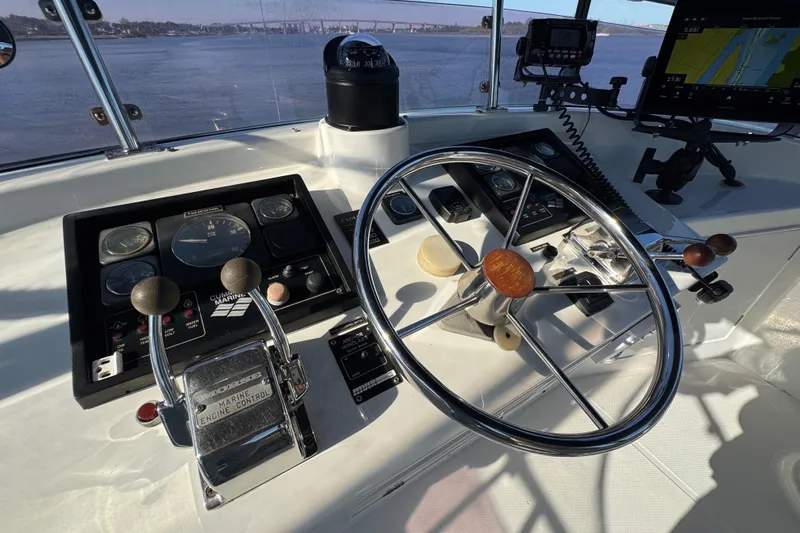  Yacht Photos Pics Control panel of a 2006 Albin 40 North Sea Cutter with steering wheel and navigation instruments.