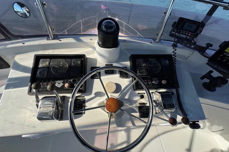  Yacht Photos Pics Helm of 2006 Albin 40 North Sea Cutter with steering wheel and navigation controls.