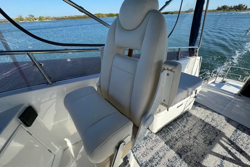 Yacht Photos Pics Captain's chair on 2006 Albin 40 North Sea Cutter, overlooking serene waters.