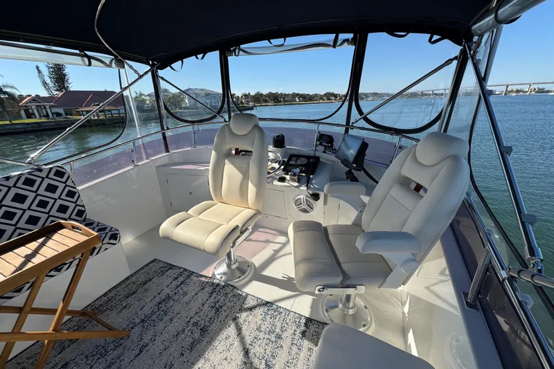  Yacht Photos Pics Interior of 2006 Albin 40 North Sea Cutter with helm and seating, overlooking water.