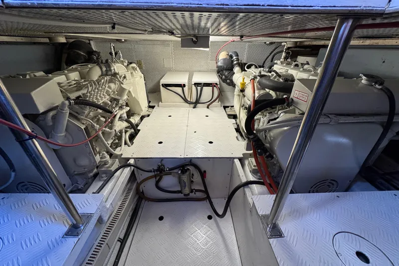  Yacht Photos Pics Engine room of a 2006 Albin 40 North Sea Cutter, showcasing dual engines and mechanical components.