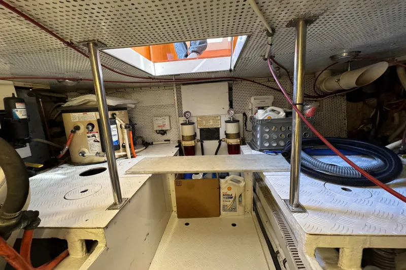  Yacht Photos Pics Engine room of a 2006 Albin 40 North Sea Cutter, featuring equipment and storage.