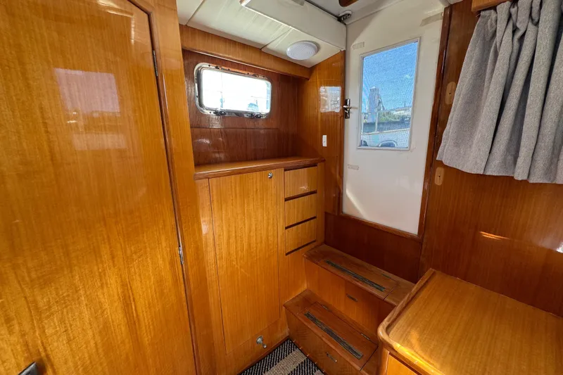  Yacht Photos Pics Interior of 2006 Albin 40 North Sea Cutter with wooden cabinetry and window.