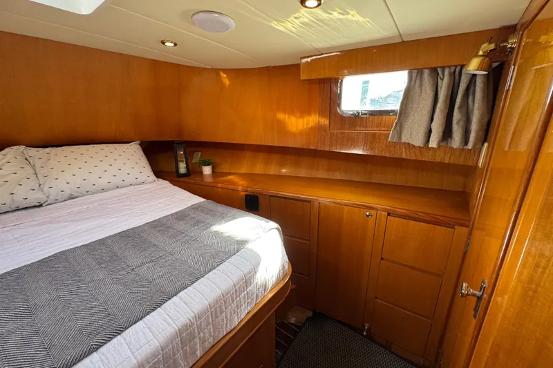  Yacht Photos Pics Cozy cabin interior of 2006 Albin 40 North Sea Cutter with wood finish and bed.