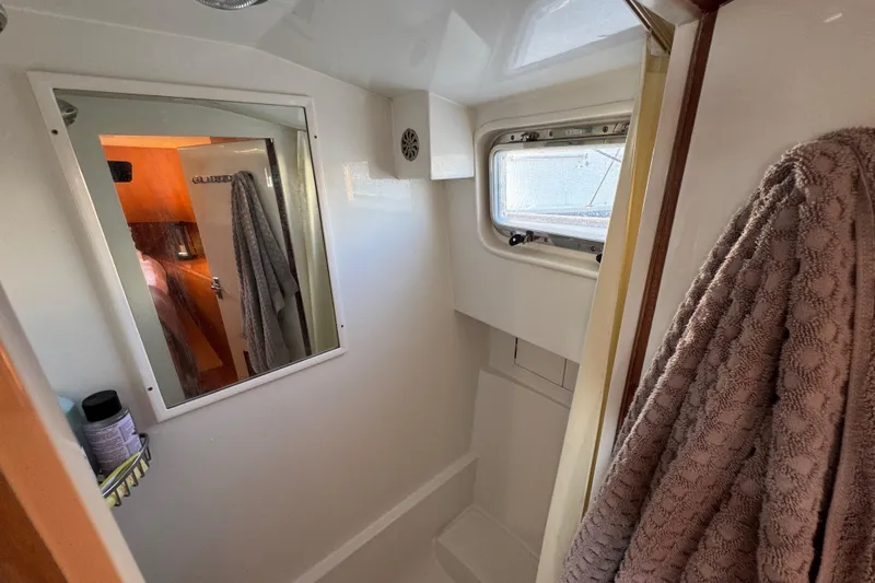  Yacht Photos Pics Bathroom interior of 2006 Albin 40 North Sea Cutter with mirror and window.