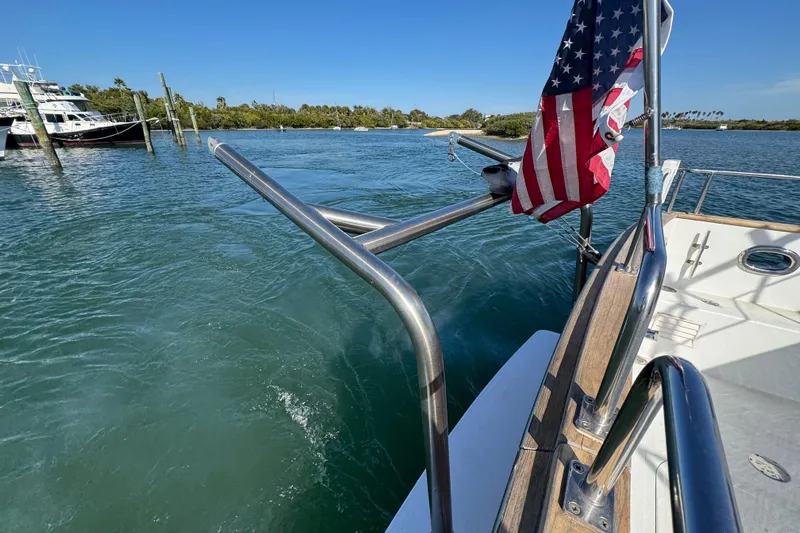  Yacht Photos Pics 2006 Albin 40 North Sea Cutter on water, American flag, sunny day.