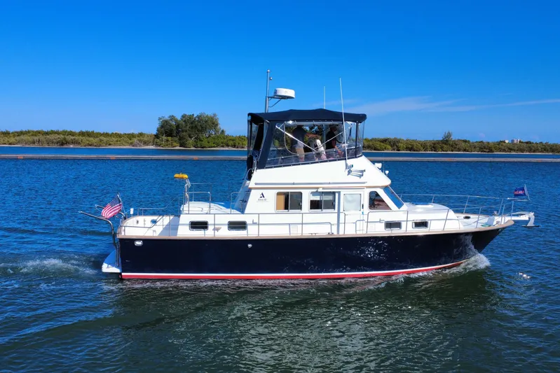  Yacht Photos Pics 2006 Albin 40 North Sea Cutter cruising on a sunny day, displaying American flag.