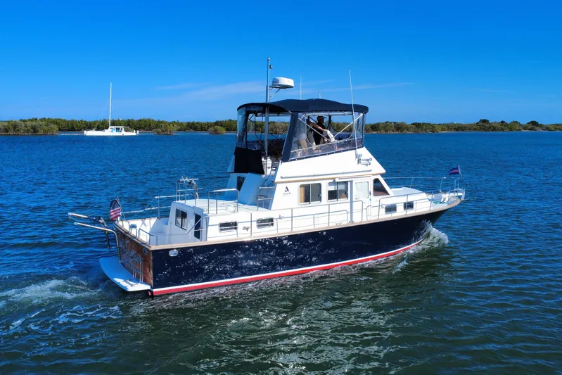  Yacht Photos Pics 2006 Albin 40 North Sea Cutter cruising on a sunny day in open waters.