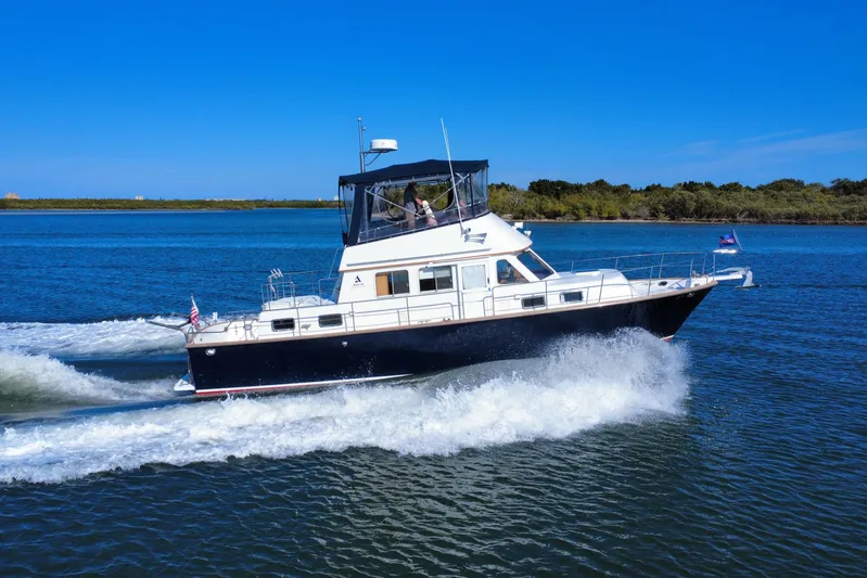  Yacht Photos Pics 2006 Albin 40 North Sea Cutter cruising on a sunny day, creating waves.