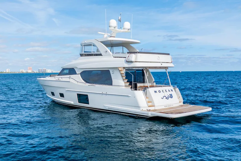 Mocean Yacht Photos Pics 2021 Ocean Alexander 70E Motoryacht cruising on open blue sea.