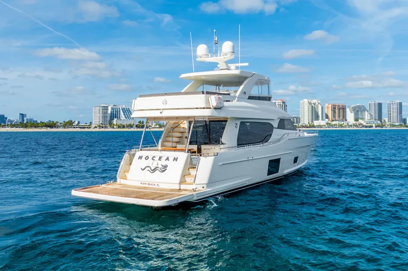 Mocean Yacht Photos Pics 2021 Ocean Alexander 70E Motoryacht cruising near Miami Beach skyline.