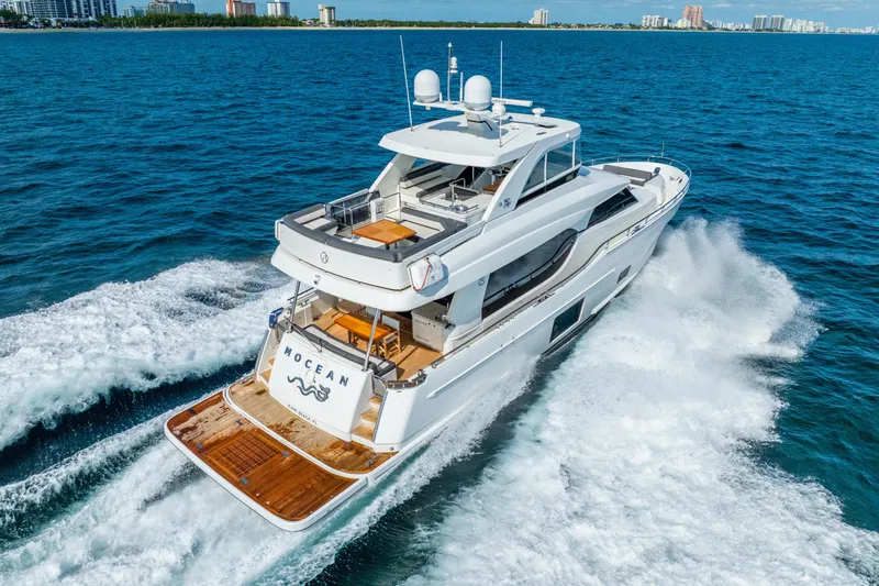 Mocean Yacht Photos Pics 2021 Ocean Alexander 70E Motoryacht cruising on open water, showcasing luxury and performance.