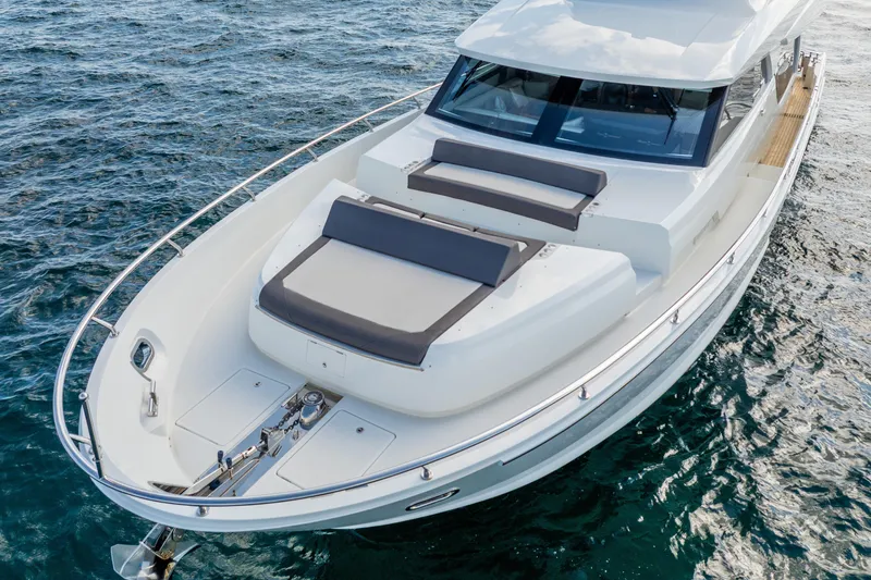 Mocean Yacht Photos Pics 2021 Ocean Alexander 70E Motoryacht on water, featuring sleek design and spacious deck.