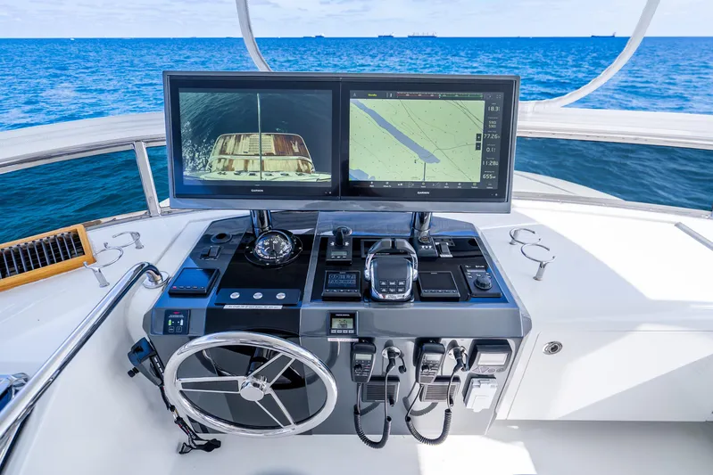 Mocean Yacht Photos Pics Helm of 2021 Ocean Alexander 70E Motoryacht with navigation screens and controls.