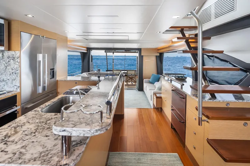Mocean Yacht Photos Pics Luxurious interior of 2021 Ocean Alexander 70E Motoryacht with modern kitchen and ocean view.