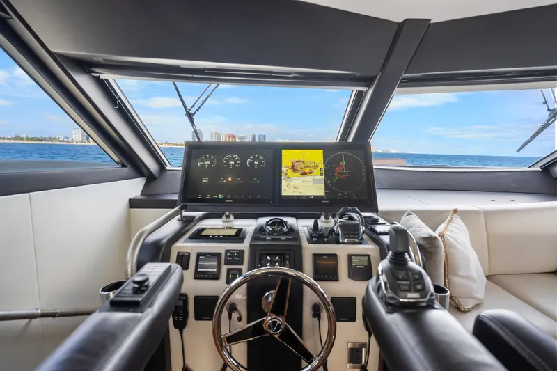 Mocean Yacht Photos Pics Cockpit of 2021 Ocean Alexander 70E Motoryacht with navigation screens and steering wheel.