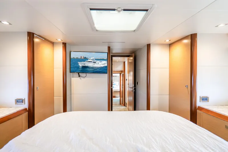 Mocean Yacht Photos Pics Luxurious bedroom interior of 2021 Ocean Alexander 70E Motoryacht with TV and skylight.