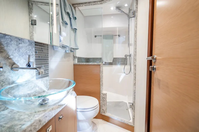 Mocean Yacht Photos Pics Luxurious bathroom in 2021 Ocean Alexander 70E Motoryacht with glass sink and modern shower.