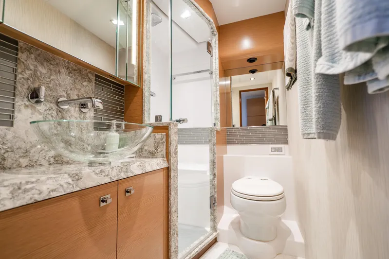Mocean Yacht Photos Pics Luxurious bathroom in 2021 Ocean Alexander 70E Motoryacht with modern fixtures and elegant design.