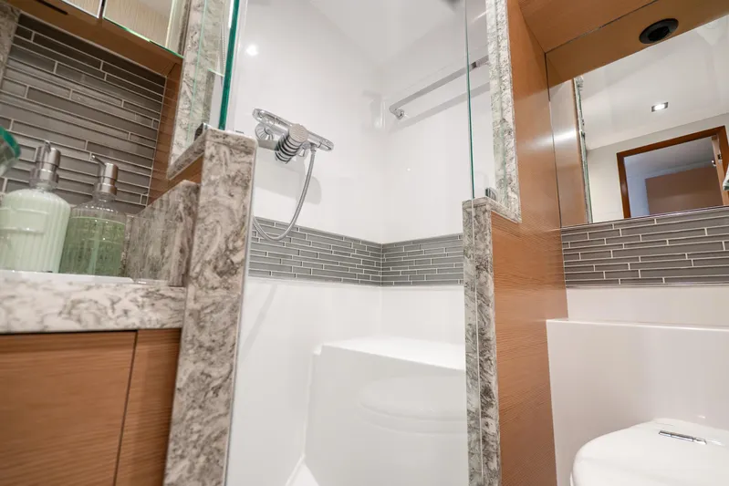 Mocean Yacht Photos Pics Luxurious bathroom in 2021 Ocean Alexander 70E Motoryacht with modern fixtures and elegant design.