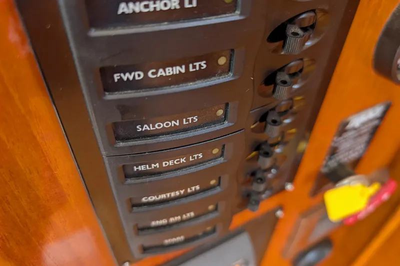 Cloud Nine Yacht Photos Pics Control panel of 2006 Grand Banks 49 Eastbay SX yacht with labeled switches.